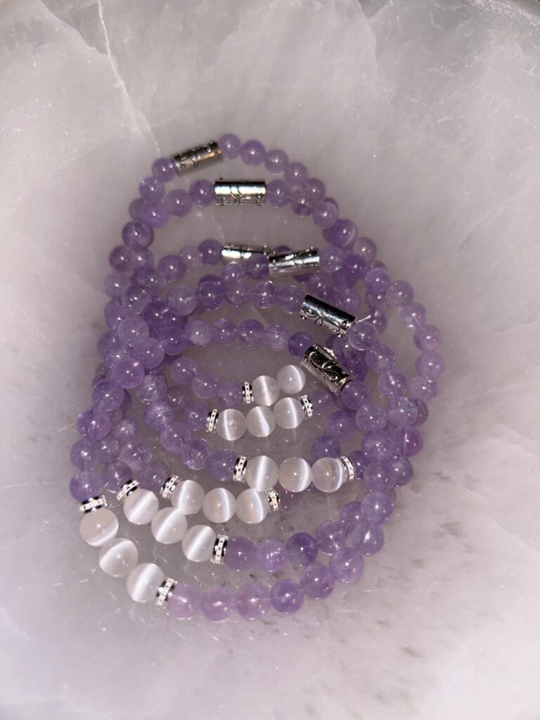 Amethyst, Selenite, and silver bracelets On Tray