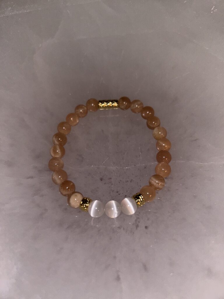 Single Peach Moonstone Bracelet on dark marble