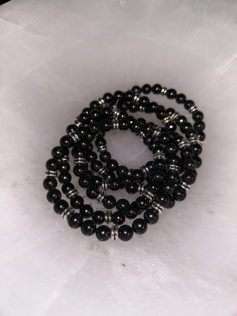 Pile of Shungite Antique Silver Braceletes on Marble